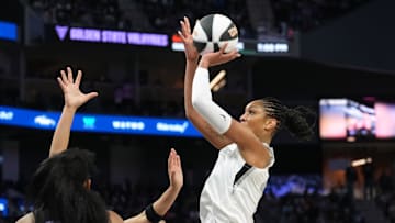 Jun 7, 2025; San Francisco, California, USA; Las Vegas Aces center A'ja Wilson (right) shoots against Golden State Valkyries forward Monique Billings (25) during the third quarter at Chase Center. 