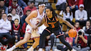 Dec 3, 2024; Bloomington, Indiana, USA; Sam Houston State Bearkats guard Lamar Wilkerson (3) dribbles the ball while Indiana Hoosiers guard Trey Galloway (32) defends in the first half at Simon Skjodt Assembly Hall. Mandatory Credit: Trevor Ruszkowski-Imagn Images