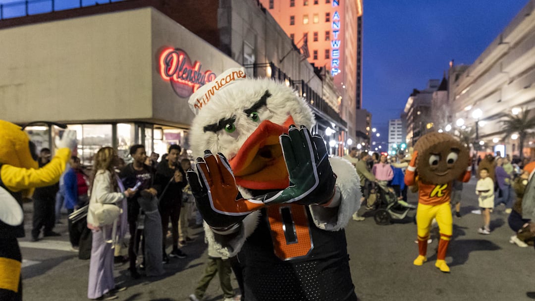 Jan 31, 2025; Mobile, AL, USA; Miami Hurricanes mascot Sebastian the Ibisas joins Senior Bowl football players in the Mardi Gras player parade in downtown Mobile. Mandatory Credit: Vasha Hunt-Imagn Images

