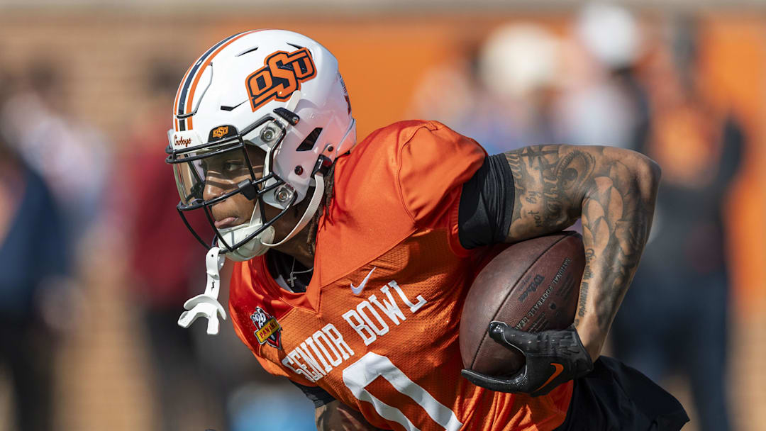 National team running back Ollie Gordon II of Oklahoma State (0) runs the ball during Senior Bowl practice for the National team at Hancock Whitney Stadium. National team running back Ollie Gordon II of Oklahoma State (0) runs the ball during Senior Bowl practice for the National team at Hancock Whitney Stadium.