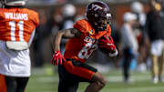 Jan 28, 2025; Mobile, AL, USA; National team wide receiver Jaylin Lane of Virginia Tech (83) runs the ball during Senior Bowl practice for the National team at Hancock Whitney Stadium. Mandatory Credit: Vasha Hunt-Imagn Images