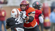 National team offensive lineman Jalen Travis of Iowa State (72) works against National team defensive lineman Collin Oliver of Oklahoma State (30) during Senior Bowl practice for the National team at Hancock Whitney Stadium.