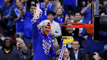 Mar 29, 2025; Newark, NJ, USA; Duke basketball head coach Jon Scheyer cuts down the net after the Duke Blue Devils beat the Alabama Crimson Tide in the East Regional final of the 2025 NCAA tournament at Prudential Center.