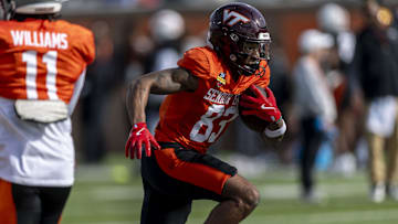 Jan 28, 2025; Mobile, AL, USA; National team wide receiver Jaylin Lane of Virginia Tech (83) runs the ball during Senior Bowl practice for the National team at Hancock Whitney Stadium. Mandatory Credit: Vasha Hunt-Imagn Images