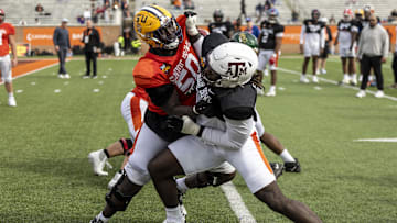 Jan 28, 2025; Mobile, AL, USA; American team offensive lineman Emery Jones of LSU (50) spars with American team defensive lineman Shemar Stewart of Texas A&M (14) during Senior Bowl practice for the American team at Hancock Whitney Stadium. Mandatory Credit: Vasha Hunt-Imagn Images