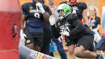 Jan 30, 2025; Mobile, AL, USA; National team defensive lineman Jamaree Caldwell of Oregon (90) works through drills during Senior Bowl practice for the National team at Hancock Whitney Stadium. Mandatory Credit: Vasha Hunt-Imagn Images
