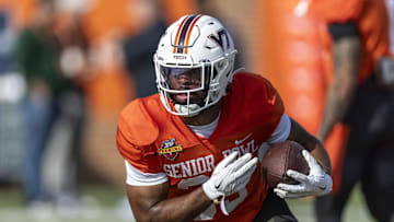 Jan 29, 2025; Mobile, AL, USA; National team running back Bhayshul Tuten of Virginia Tech (33) runs the ball during Senior Bowl practice for the National team at Hancock Whitney Stadium. Mandatory Credit: Vasha Hunt-Imagn Images