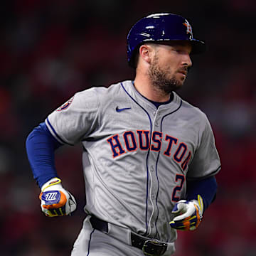 Sep 13, 2024; Anaheim, California, USA; Houston Astros third baseman Alex Bregman (2) hits a single against the Los Angeles Angels during the seventh inning at Angel Stadium.