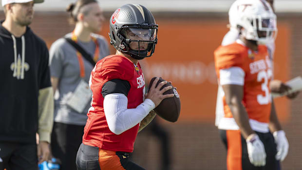 Jan 29, 2025; Mobile, AL, USA; National team quarterback Dillon Gabriel of Oregon (8) drops to pass during Senior Bowl practi