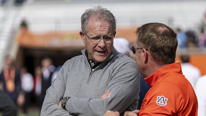 Jan 29, 2025; Mobile, AL, USA; Florida State offensive coordinator Gus Malzahn talks with Auburn head coach Hugh Freeze during Senior Bowl practice for the American team at Hancock Whitney Stadium. Malzahn is a former Auburn football head coach. Mandatory Credit: Vasha Hunt-Imagn Images