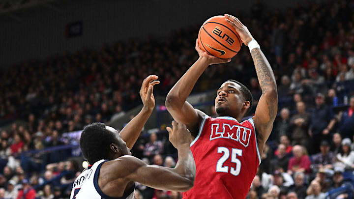 Feb 6, 2025; Spokane, Washington, USA; Loyola Marymount Lions forward Caleb Stone-Carrawell (25) shoots over Gonzaga Bulldogs forward Emmanuel Innocenti (5) in the second half at McCarthey Athletic Center. Gonzaga Bulldogs won 73-53. Mandatory Credit: James Snook-Imagn Images