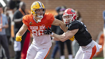 Jan 30, 2025; Mobile, AL, USA; American team tight end Mason Taylor of LSU (86) and American team defensive back Dan Jackson of Georgia (37) spar during Senior Bowl practice for the American team at Hancock Whitney Stadium. Mandatory Credit: Vasha Hunt-Imagn Images
