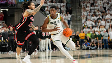 Mar 8, 2025; Waco, Texas, USA; Baylor Bears guard VJ Edgecombe (7) drives to the basket as Houston Cougars guard Emanuel Sharp (21) defends during the second half at Paul and Alejandra Foster Pavilion. Mandatory Credit: Chris Jones-Imagn Images