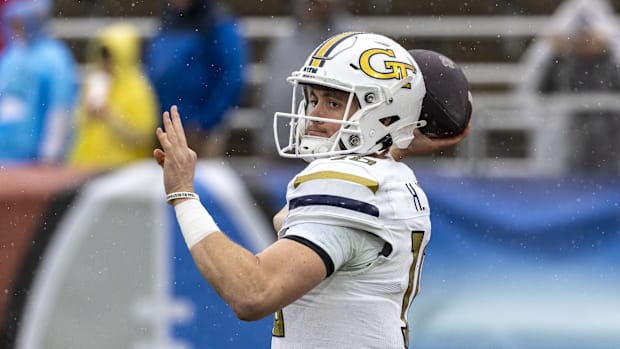 Georgia Tech Yellow Jackets quarterback Haynes King (10) warms up before the 2024 Birmingham Bowl at Protective Stadium.