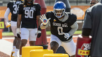 Jan 29, 2025; Mobile, AL, USA; American team defensive lineman Deone Walker of Kentucky (0) works in a drill during Senior Bowl practice for the National team at Hancock Whitney Stadium. Mandatory Credit: Vasha Hunt-Imagn Images