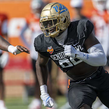 National team defensive lineman Oluwafemi Oladejo of UCLA runs through a drill during Senior Bowl practice.