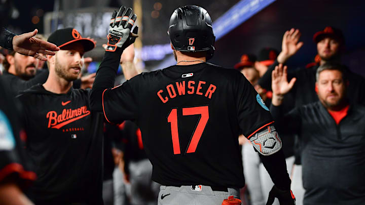 Aug 29, 2024; Los Angeles, California, USA; Baltimore Orioles left fielder Colton Cowser (17) is greeted after hitting a three run home run against the Los Angeles Dodgers during the fifth inning at Dodger Stadium