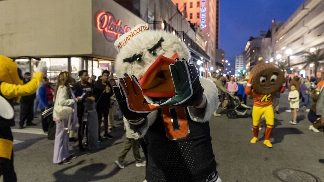Jan 31, 2025; Mobile, AL, USA; Miami Hurricanes mascot Sebastian the Ibisas joins Senior Bowl football players in the Mardi Gras player parade in downtown Mobile. Mandatory Credit: Vasha Hunt-Imagn Images

