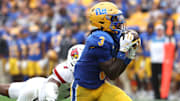 Sep 27, 2025; Pittsburgh, Pennsylvania, USA;  Pittsburgh Panthers wide receiver Cataurus Hicks (3) catches a pass against Louisville Cardinals defensive back Jabari Mack (4) during the third quarter at Acrisure Stadium. Mandatory Credit: Charles LeClaire-Imagn Images
