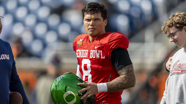 Jan 28, 2025; Mobile, AL, USA; National team quarterback Dillon Gabriel of Oregon (8) pauses after practice during Senior Bow