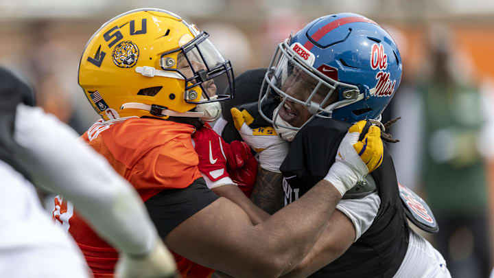 Jan 28, 2025; Mobile, AL, USA; American team offensive lineman Miles Frazier of LSU (70) spars with American team defensive lineman Walter Nolen of Ole Miss (2) during Senior Bowl practice for the American team at Hancock Whitney Stadium. Mandatory Credit: Vasha Hunt-Imagn Images