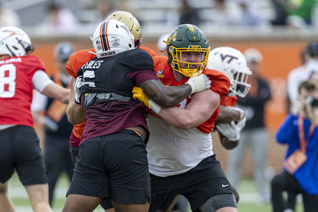 DL Aeneas Peebles of Virginia Tech battles National offensive lineman Grey Zabel of North Dakota State at theSenior Bowl 
