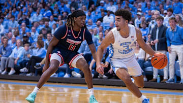 Nov 11, 2025; Chapel Hill, North Carolina, USA; Radford Highlanders guard Jr. Dennis Parker (11) presses North Carolina Tar Heels guard Derek Dixon (3) in the first half at Dean E. Smith Center. 