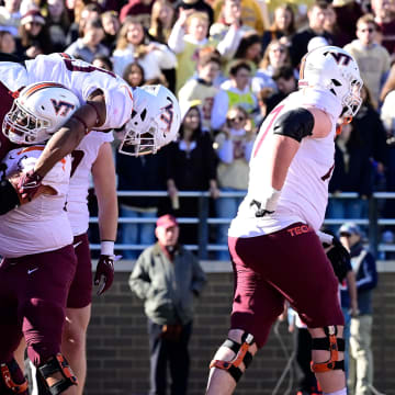 Nov 11, 2023; Chestnut Hill, Massachusetts, USA; Virginia Tech Hokies offensive lineman Kaden Moore (68) celebrates a touchdown by running back Bhayshul Tuten (33) by lifting him onto his shoulders during the first half at Alumni Stadium. Mandatory Credit: Eric Canha-USA TODAY Sports