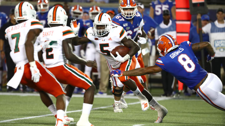 Aug 24, 2019; Orlando, FL, USA; Miami Hurricanes safety Amari Carter (5) gets the turnover against the Florida Gators during the second half at Camping World Stadium. Mandatory Credit: Kim Klement-USA TODAY Sports