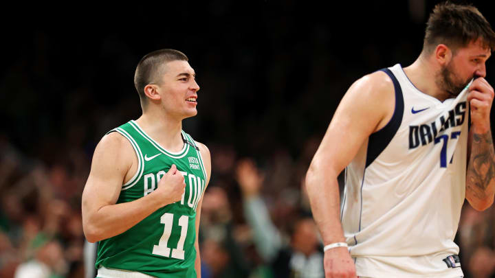 Jun 17, 2024; Boston, Massachusetts, USA; Boston Celtics guard Payton Pritchard (11) celebrates after making a three pointer at the buzzer of halftime against the Dallas Mavericks in game five of the 2024 NBA Finals at TD Garden. Mandatory Credit: Peter Casey-USA TODAY Sports