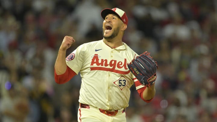 Jul 13, 2024; Anaheim, California, USA;  Carlos Estevez #53 of the Los Angeles Angels celebrates as he earns his 17th save of the season defeating the Seattle Mariners in the ninth inning at Angel Stadium. Mandatory Credit: Jayne Kamin-Oncea-USA TODAY Sports