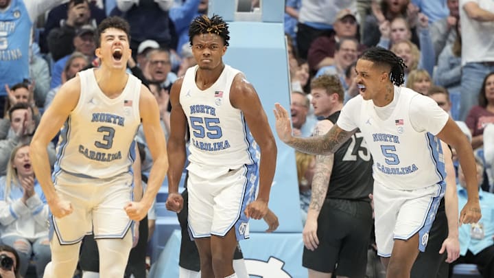 Feb 17, 2024; Chapel Hill, North Carolina, USA; North Carolina Tar Heels guard Cormac Ryan (3) and forwards Harrison Ingram (55) and Armando Bacot (5) react after Ingram scores in the first half at Dean E. Smith Center. Mandatory Credit: Bob Donnan-Imagn Images