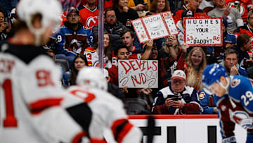 Feb 26, 2025; Denver, Colorado, USA; New Jersey Devils fans hold up signs in the second period against the Colorado Avalanche at Ball Arena. Mandatory Credit: Isaiah J. Downing-Imagn Images