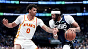 Apr 2, 2025; Dallas, Texas, USA;  Dallas Mavericks forward Anthony Davis (3) drives to the basket as Atlanta Hawks forward Dominick Barlow (0) defends during the first half at American Airlines Center. Mandatory Credit: Kevin Jairaj-Imagn Images