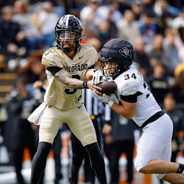 Apr 19, 2025; Boulder, CO, USA; Colorado Buffaloes quarterback Kaidon Salter (3) hands the ball off to running back Titus Bautista (34) during the spring game at Folsom Field. Mandatory Credit: Isaiah J. Downing-Imagn Images