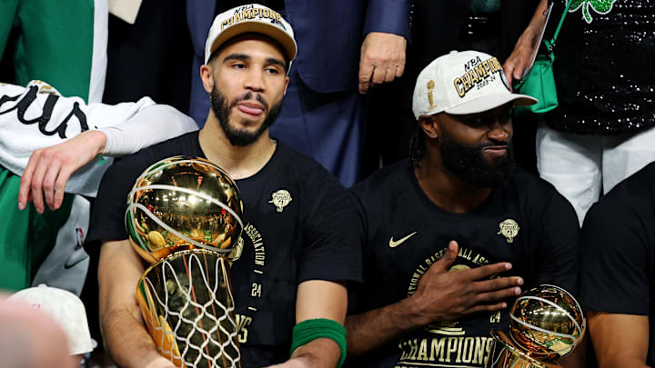 Jun 17, 2024; Boston, Massachusetts, USA; Boston Celtics forward Jayson Tatum (0) and guard Jaylen Brown (7) celebrates with the Larry O’Brian Trophy after beating the Dallas Mavericks in game five of the 2024 NBA Finals to win the NBA Championship at TD Garden. Mandatory Credit: Peter Casey-Imagn Images