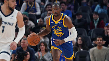 Jan 4, 2025; San Francisco, California, USA;  Golden State Warriors forward Jonathan Kuminga (00) dribbles up court in front of Memphis Grizzlies guard Scotty Pippen Jr. (1) in the second quarter at Chase Center. Mandatory Credit: David Gonzales-Imagn Images