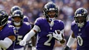 Sep 14, 2025; Baltimore, Maryland, USA; Baltimore Ravens cornerback Nate Wiggins (2) runs the ball during the third quarter at M&T Bank Stadium. Mandatory Credit: Peter Casey-Imagn Images