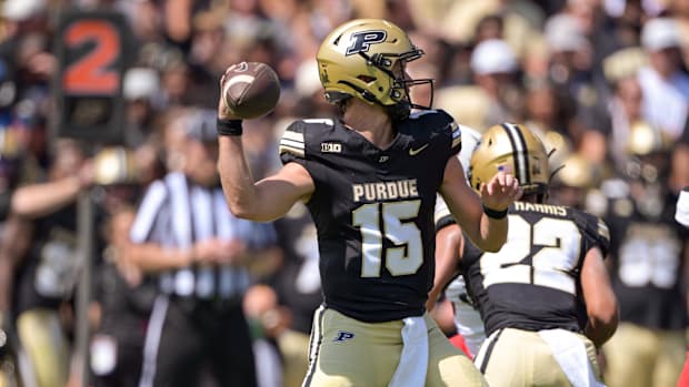 Purdue Boilermakers quarterback Ryan Browne (15) throws a pass 