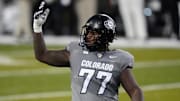 Nov 1, 2025; Boulder, Colorado, USA; Colorado Buffaloes offensive lineman Jordan Seaton (77) reacts to a penalty called during the second quarter against the Arizona Wildcats at Folsom Field. Mandatory Credit: Ron Chenoy-Imagn Images