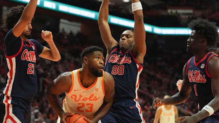 Tennessee forward Jaylen Carey (23) gets surrounded by Ole Miss guard Patton Pinkins (23), and forwarda Augusto Cassiá (88), Corey Chest (1) during an NCAA college basketball game on February 3, 2026, in Knoxville, Tennessee.