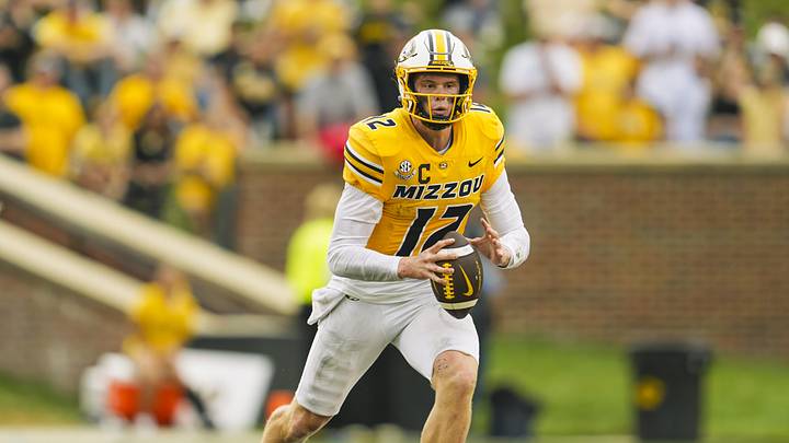 Sep 21, 2024; Columbia, Missouri, USA; Missouri Tigers quarterback Brady Cook (12) looks to pass during the second half against the Vanderbilt Commodores at Faurot Field at Memorial Stadium. Mandatory Credit: Jay Biggerstaff-Imagn Images