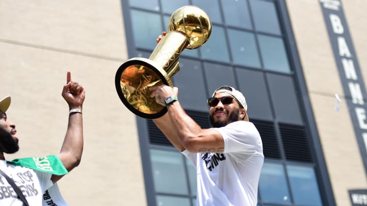 Jun 21, 2024; Boston, MA, USA;  Boston Celtics player Jayson Tatum holds the Larry OíBrien trophy during the Boston Celtics Championship parade. Mandatory Credit: Bob DeChiara-USA TODAY Sports