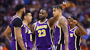 Nov 12, 2019; Phoenix, AZ, USA: Los Angeles Lakers forward LeBron James (23) talks with forward Anthony Davis (3), guard Danny Green (14), forward Kyle Kuzma (0) and guard Rajon Rondo (9) against the Phoenix Suns at Talking Stick Resort Arena. Mandatory Credit: Mark J. Rebilas-Imagn Images