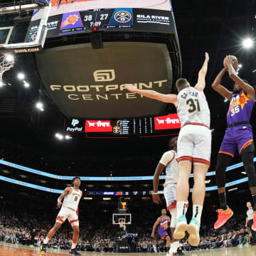 Mar 31, 2023; Phoenix, Arizona, USA; Phoenix Suns forward Kevin Durant (35) shoots over Denver Nuggets forward Vlatko Cancar (31) during the first half at Footprint Center. Mandatory Credit: Joe Camporeale-USA TODAY Sports