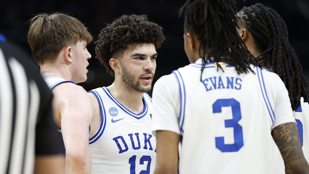Mar 29, 2026; Washington, DC, USA; Duke Blue Devils forward Cameron Boozer (12) huddles with players during a stoppage in play against the UConn Huskies in the second half during an Elite Eight game of the East Regional of the men's 2026 NCAA Tournament at Capital One Arena. Mandatory Credit: Amber Searls-Imagn Images