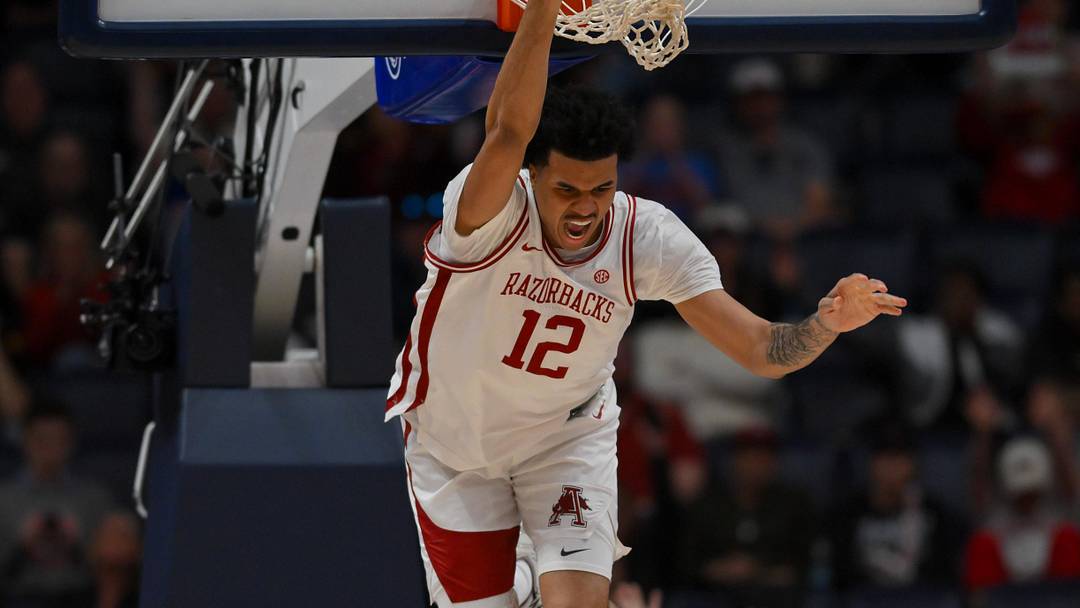 Mar 14, 2026; Nashville, TN, USA; Arkansas Razorbacks forward Malique Ewin (12) celebrates his dunk against the Mississippi Rebels during the second half at Bridgestone Arena. Mandatory Credit: Steve Roberts-Imagn Images Mar 14, 2026; Nashville, TN, USA; Arkansas Razorbacks forward Malique Ewin (12) celebrates his dunk against the Mississippi Rebels during the second half at Bridgestone Arena. Mandatory Credit: Steve Roberts-Imagn Images