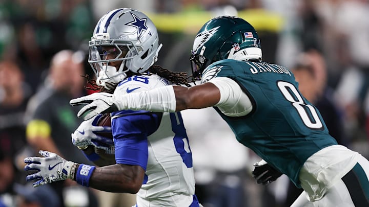Sep 4, 2025; Philadelphia, Pennsylvania, USA; Philadelphia Eagles cornerback Adoree' Jackson (8) tackles Dallas Cowboys wide receiver CeeDee Lamb (88) during the first quarter of the game at Lincoln Financial Field. Mandatory Credit: Bill Streicher-Imagn Images