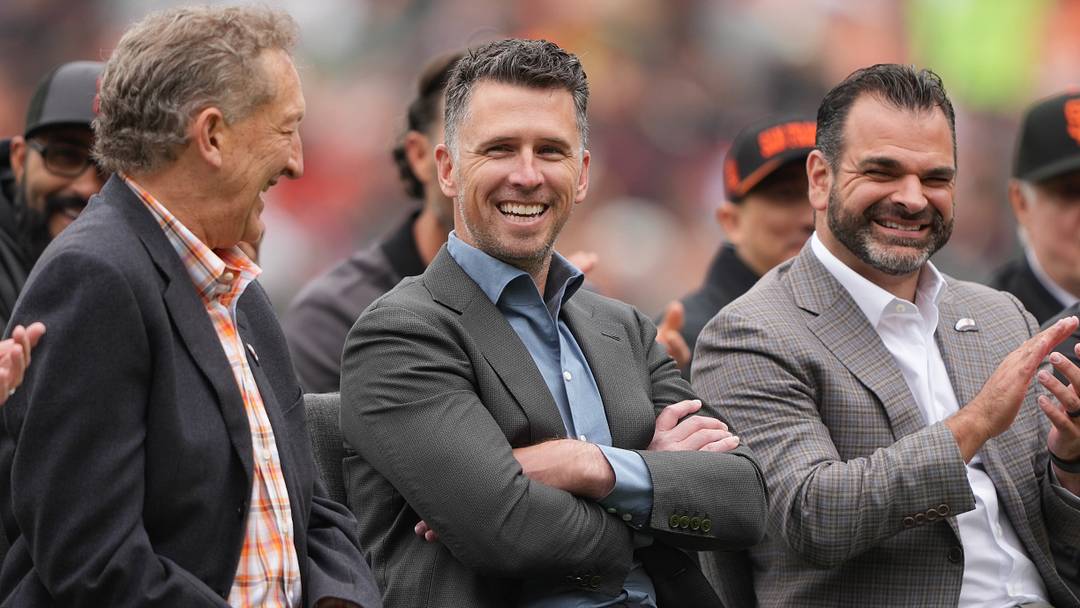USA; San Francisco Giants president of baseball operations Buster Posey (center) sits on the field with president Larry Baer (left) and general manager Zack Minasian (right). Credit: Darren Yamashita-Imagn Images USA; San Francisco Giants president of baseball operations Buster Posey (center) sits on the field with president Larry Baer (left) and general manager Zack Minasian (right). Credit: Darren Yamashita-Imagn Images