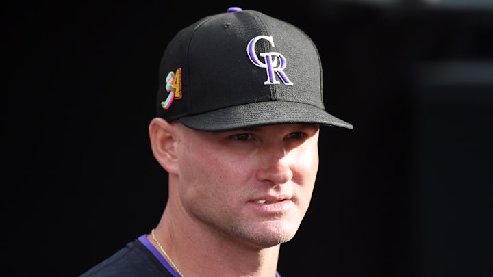 Aug 16, 2025; Denver, Colorado, USA; Colorado Rockies interim manager Warren Schaeffer (34) looks on from the bench before the game against the Arizona Diamondbacks at Coors Field. 